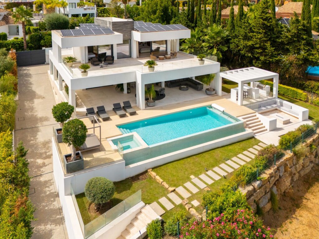 Modern luxury villa for sale on the Costa del Sol with private pool, terrace, garden, and contemporary architecture in a prime residential area